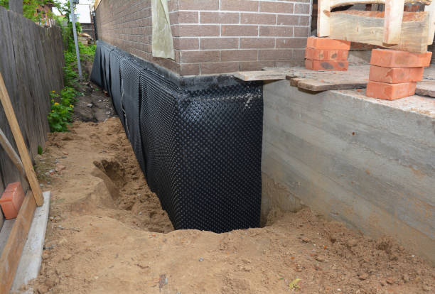 Happy homeowners after waterproofing job in Bumpus Mills